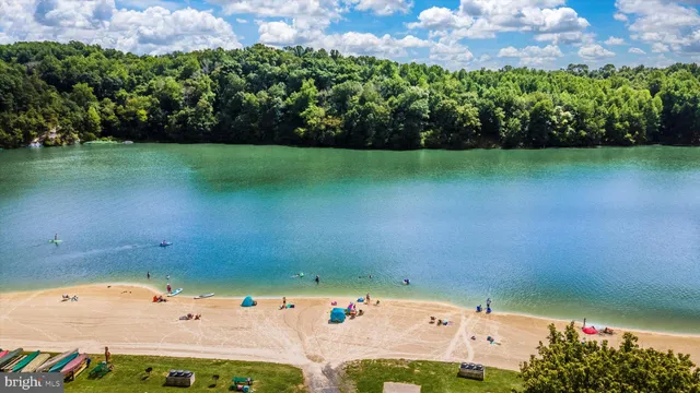 an aerial view of a houses with a yard
