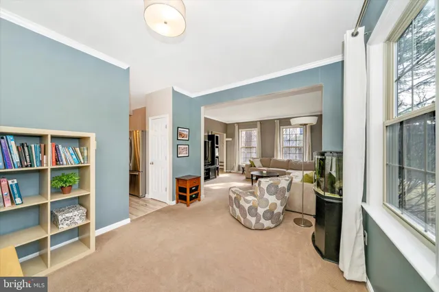a view of a livingroom with furniture and windows