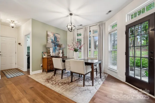 a view of a livingroom with furniture window and wooden floor