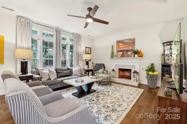 a living room with furniture and a fireplace