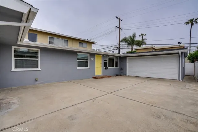 a front view of a house with a garage