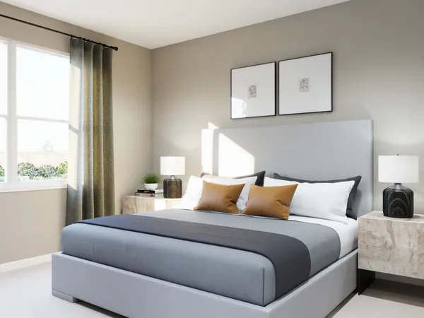 a bedroom with a bed and painting on the wall