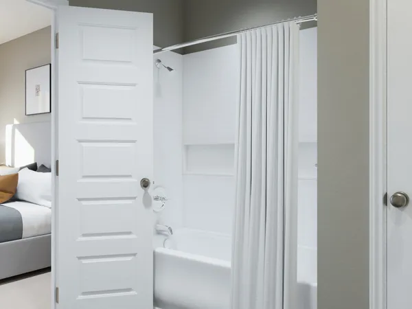 a bathroom with a shower and a mirror