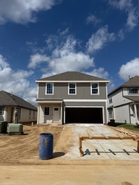 13650 Kit Run Splendora, TX 77372 - Photo 2 of 35 a front view of a house with a balcony
