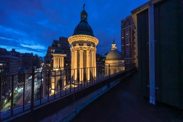 a view of a building with a view of a city