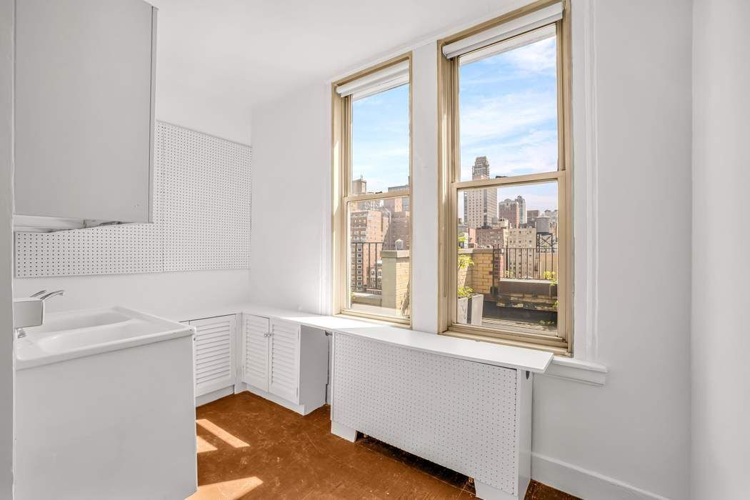 1065 Lexington Avenue, Unit PHA Manhattan, NY 10021 - Photo 5 of 12 a bathroom with a sink and a window