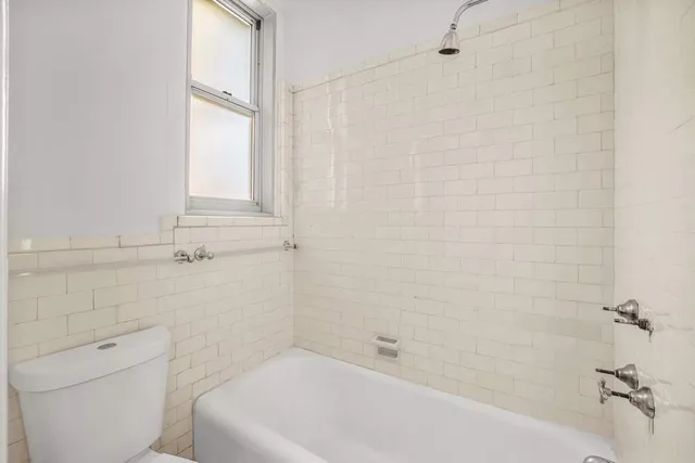 a bathroom with a sink and a window