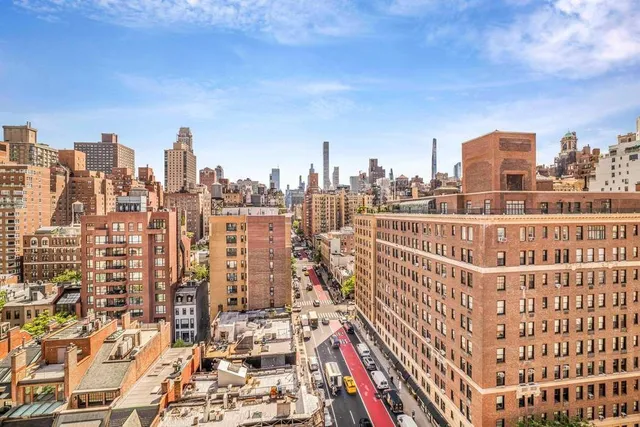 a bathroom with a toilet and bathtub