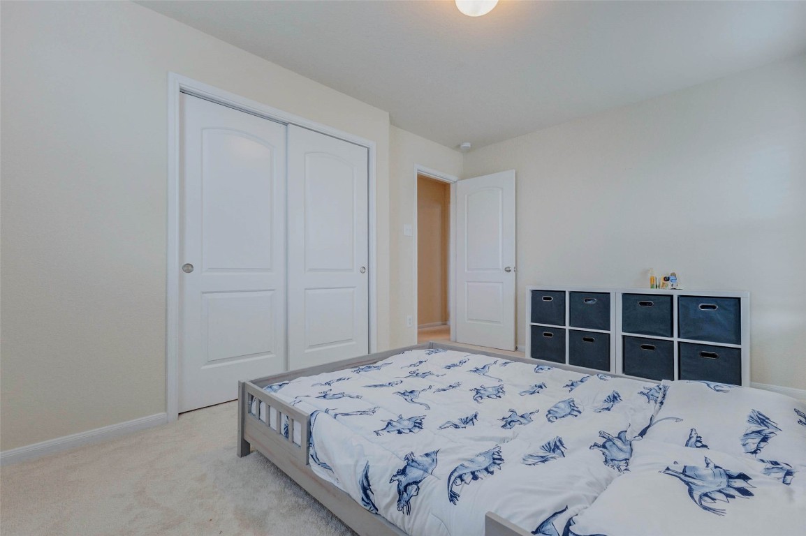 20623 Footstep Path Katy, TX 77449 - Photo 17 of 23 a bedroom with a bed and closet