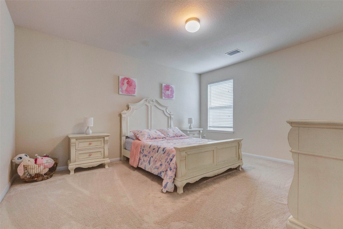 20623 Footstep Path Katy, TX 77449 - Photo 19 of 23 a bedroom with a bed and a window