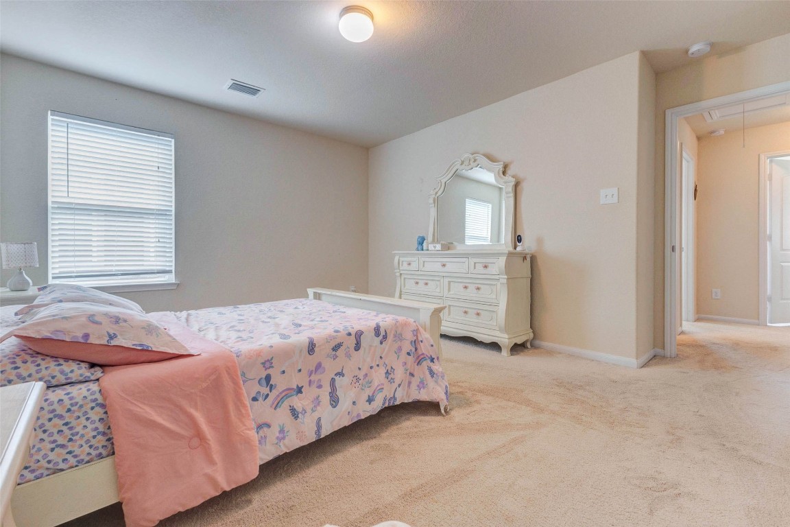 20623 Footstep Path Katy, TX 77449 - Photo 20 of 23 a bedroom with a bed and dresser