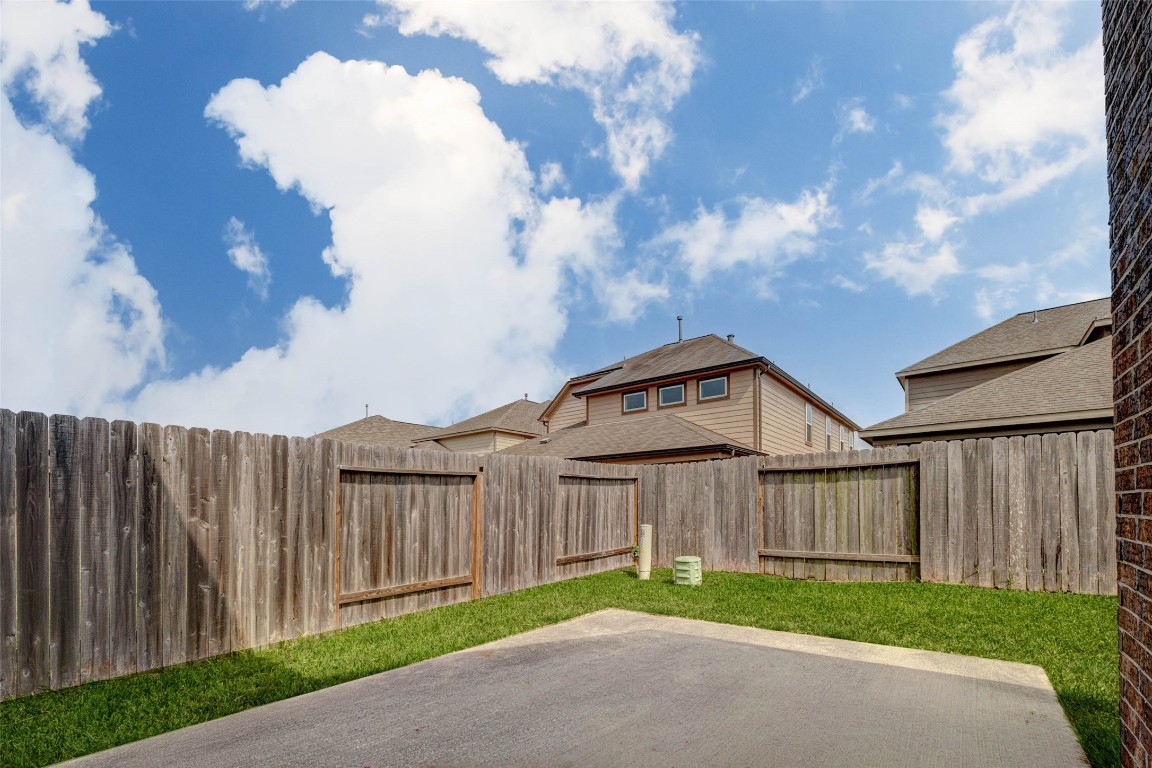 20623 Footstep Path Katy, TX 77449 - Photo 21 of 23 a view of a house with wooden fence next to a road
