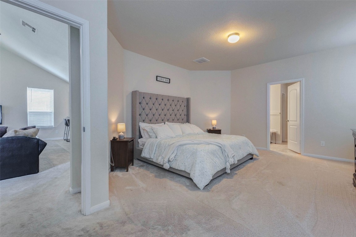 20623 Footstep Path Katy, TX 77449 - Photo 9 of 23 a bedroom with a bed and a couch