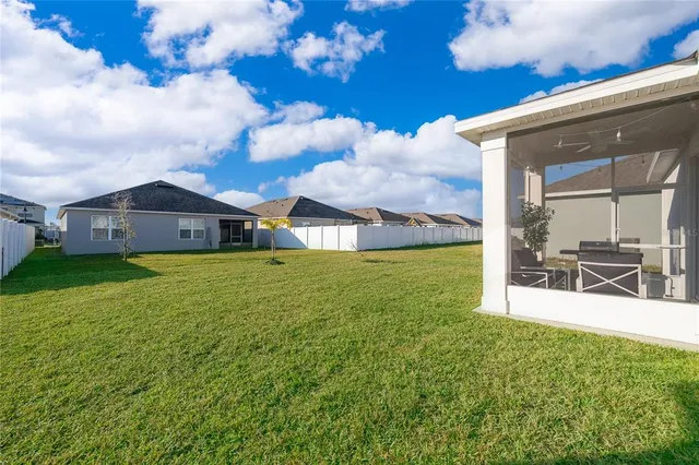 an aerial view of a residential apartment building with a yard