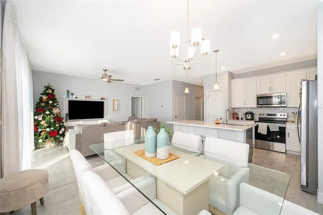 a living room with furniture and flowers