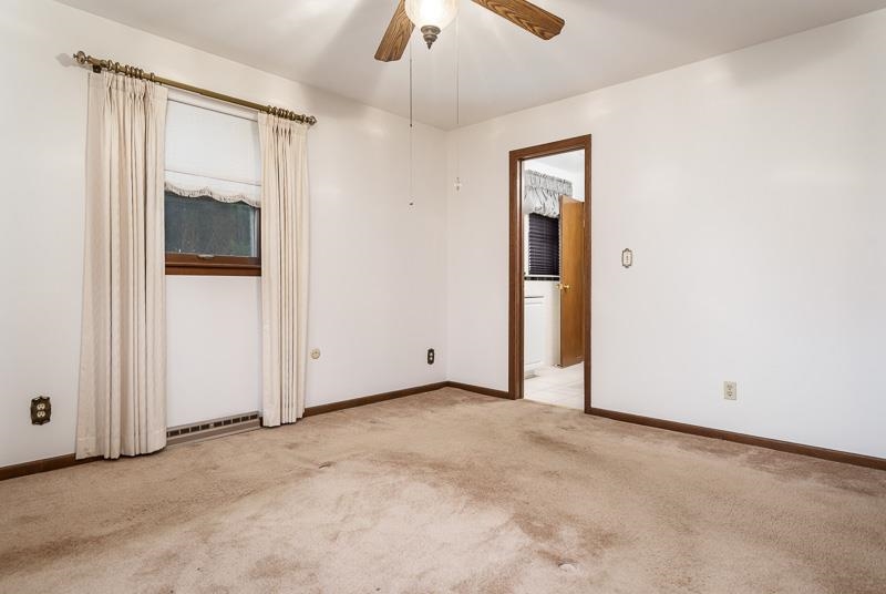 1110 Roxbury Close Rockford, IL 61107 - Photo 13 of 36 an empty room with chandelier fan