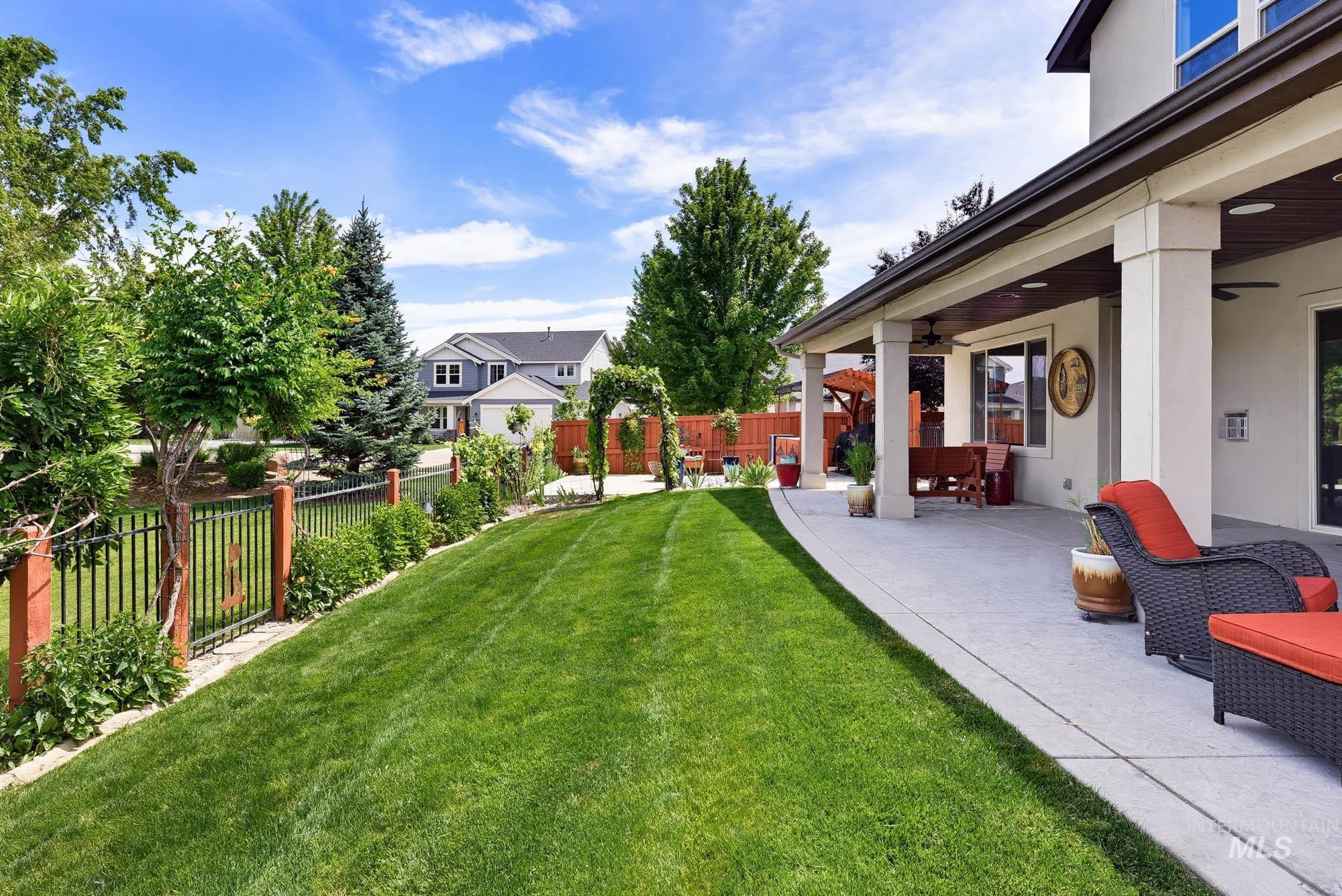 220 South Wildgrass Way Star, ID 83669 - Photo 36 of 50 Expansive property featuring a tranquil community pond with a central fountain