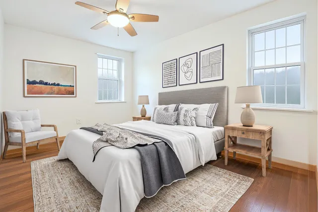 a bed room with a bed and a window