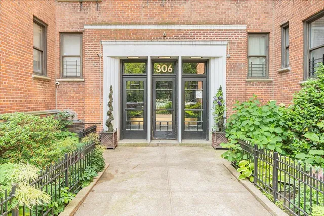 front view of a house with a large window