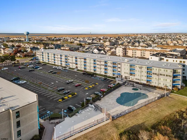 a view of street with parked cars