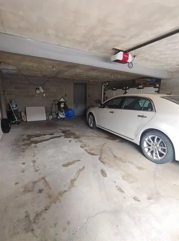 a view of parking garage with cars