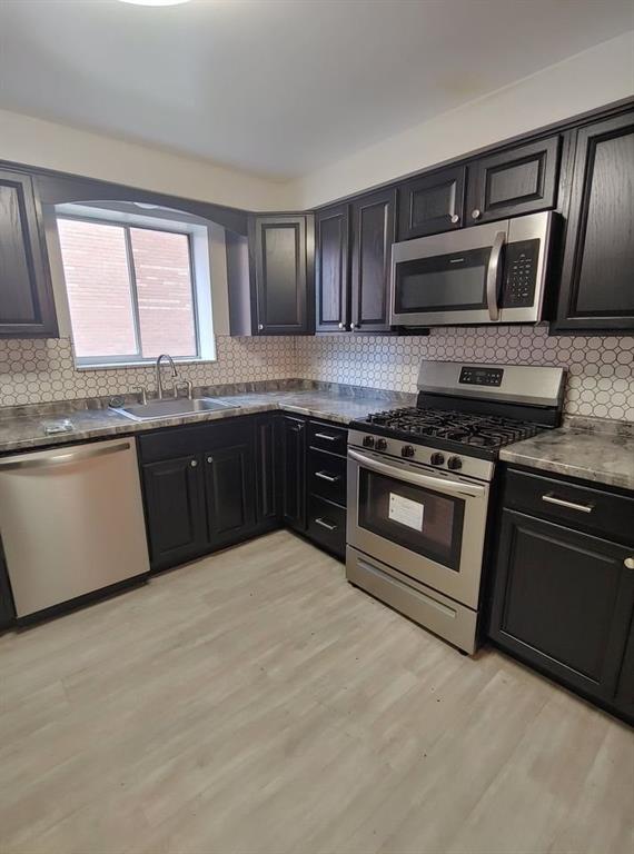 4 Fountain Street, Unit 3 Pittsburgh, PA 15205 - Photo 3 of 24 a kitchen with stainless steel appliances granite countertop a stove and a sink
