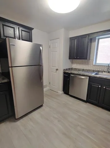 a view of a kitchen with a sink