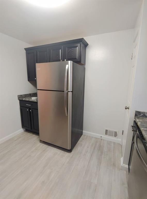 4 Fountain Street, Unit 3 Pittsburgh, PA 15205 - Photo 7 of 24 a view of a refrigerator in kitchen and an empty room