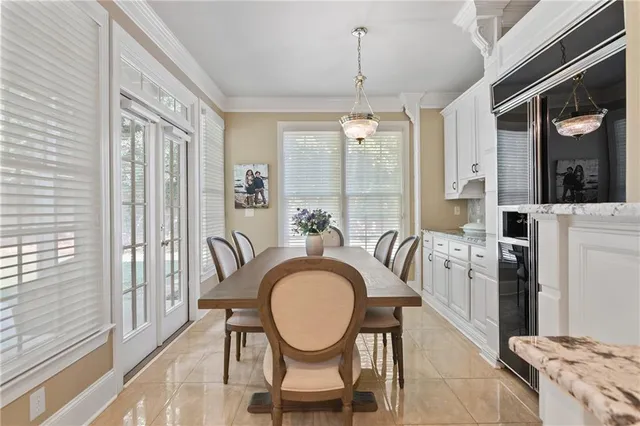 a very nice looking dining room with a table and chairs