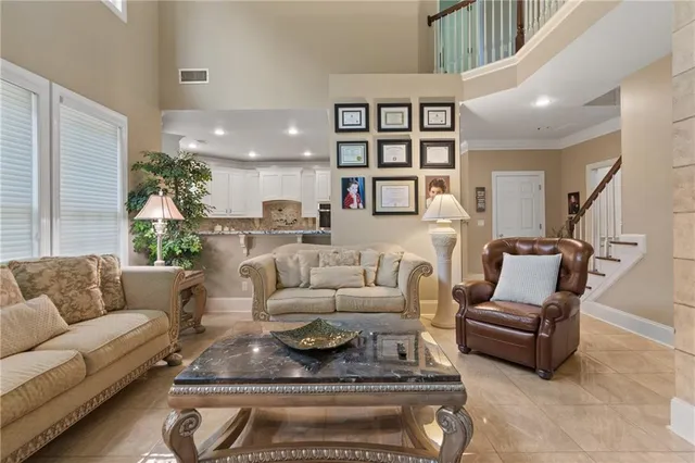 a living room with furniture or couch and a potted plant