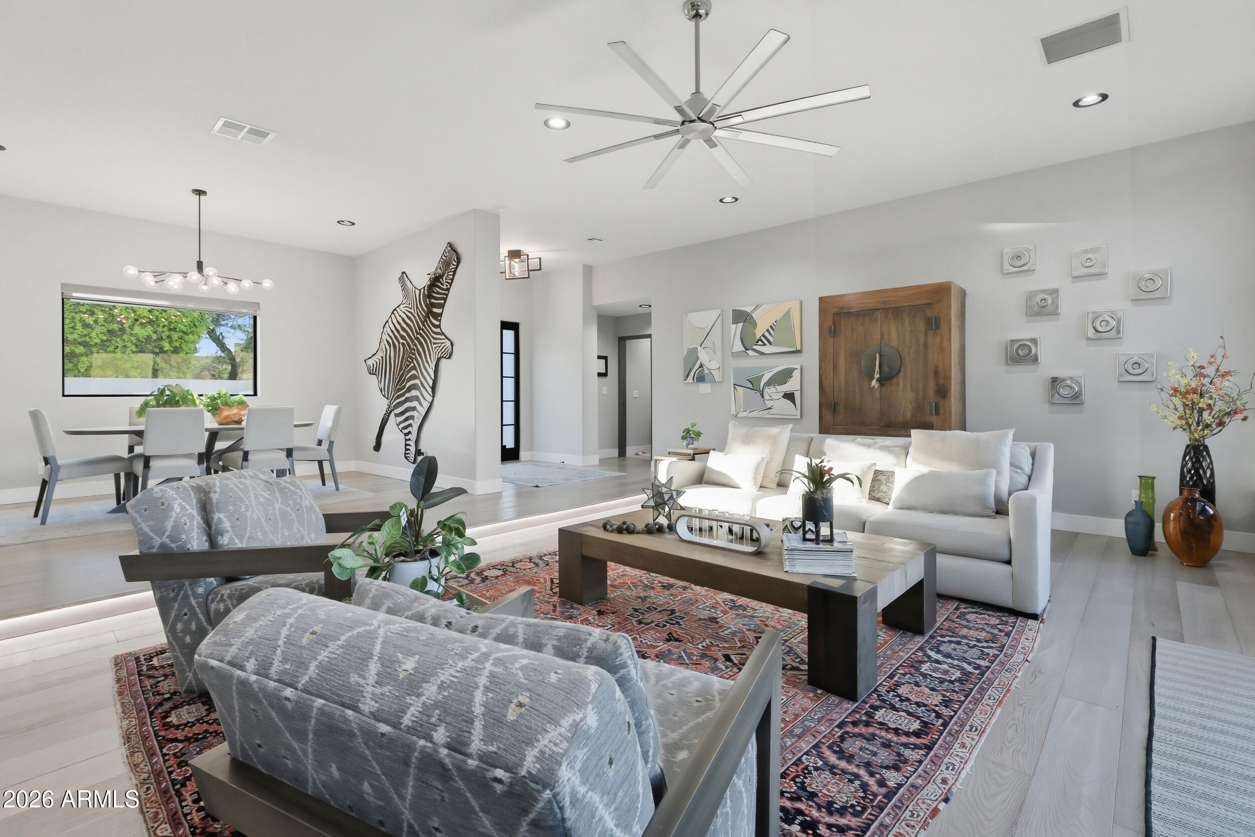 4417 East Mountain View Road Phoenix, AZ 85028 - Photo 9 of 41 a living room with furniture and a chandelier