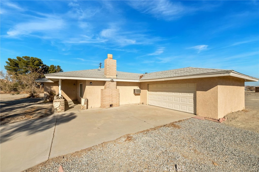 19665 Grey Mountain Road Adelanto, CA 92301 - Photo 15 of 30 a view of a house with a backyard