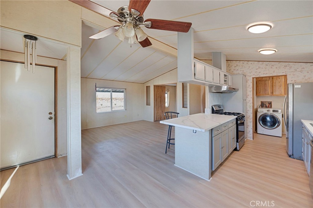 19665 Grey Mountain Road Adelanto, CA 92301 - Photo 21 of 30 a kitchen with stove and wooden floor