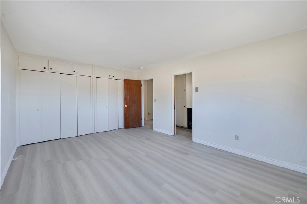 19665 Grey Mountain Road Adelanto, CA 92301 - Photo 10 of 30 a view of an empty room with wooden floor