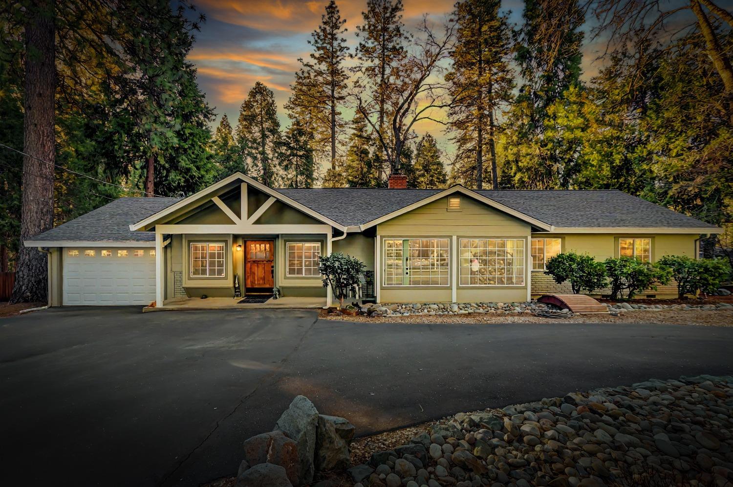 15668 Ridge Estates Road Nevada City, CA 95959 - Photo 1 of 1 a front view of a house with yard and green space