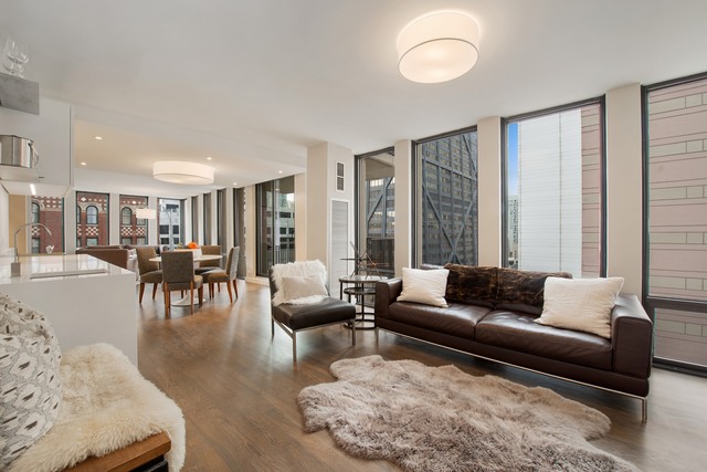 200 East Delaware Place, Unit 18F Chicago, IL 60611 - Photo 11 of 38 a living room with furniture and a large window