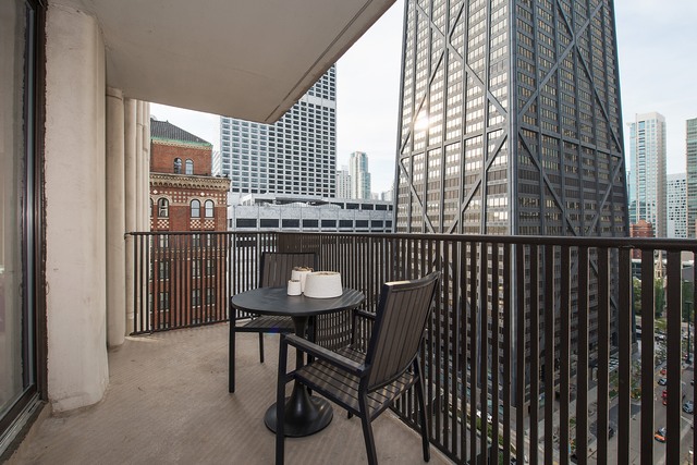 200 East Delaware Place, Unit 18F Chicago, IL 60611 - Photo 20 of 38 a view of a balcony with chairs