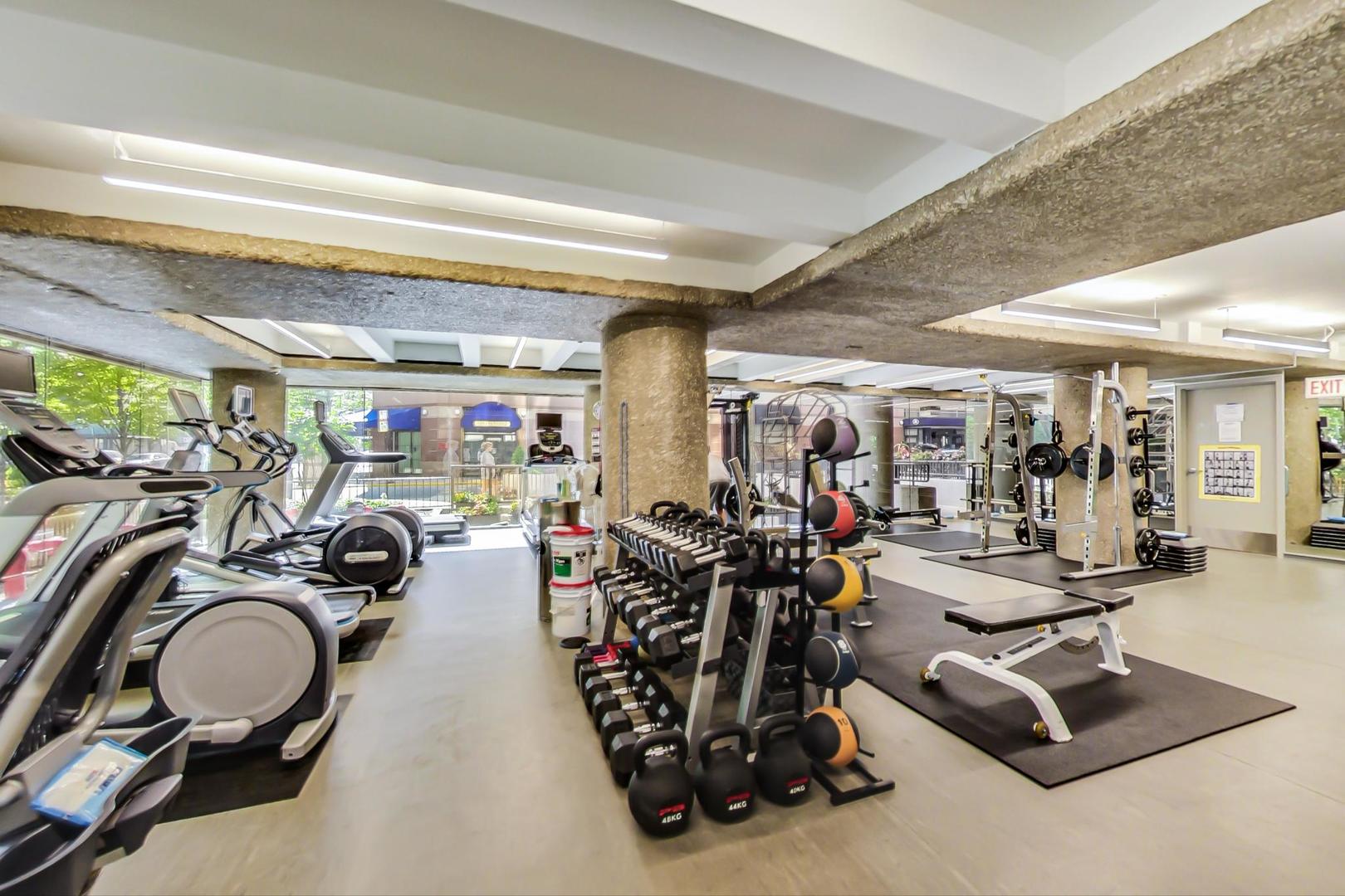 200 East Delaware Place, Unit 18F Chicago, IL 60611 - Photo 34 of 38 a view of a room with gym equipment