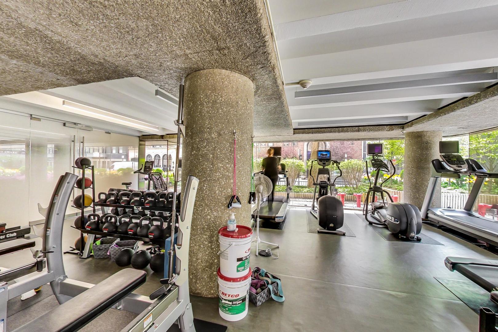 200 East Delaware Place, Unit 18F Chicago, IL 60611 - Photo 36 of 38 a view of a room with gym equipment