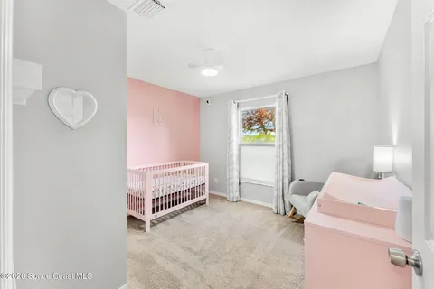 a room with a bed and a window