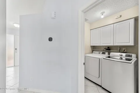 a view of a storage & utility room with a sink