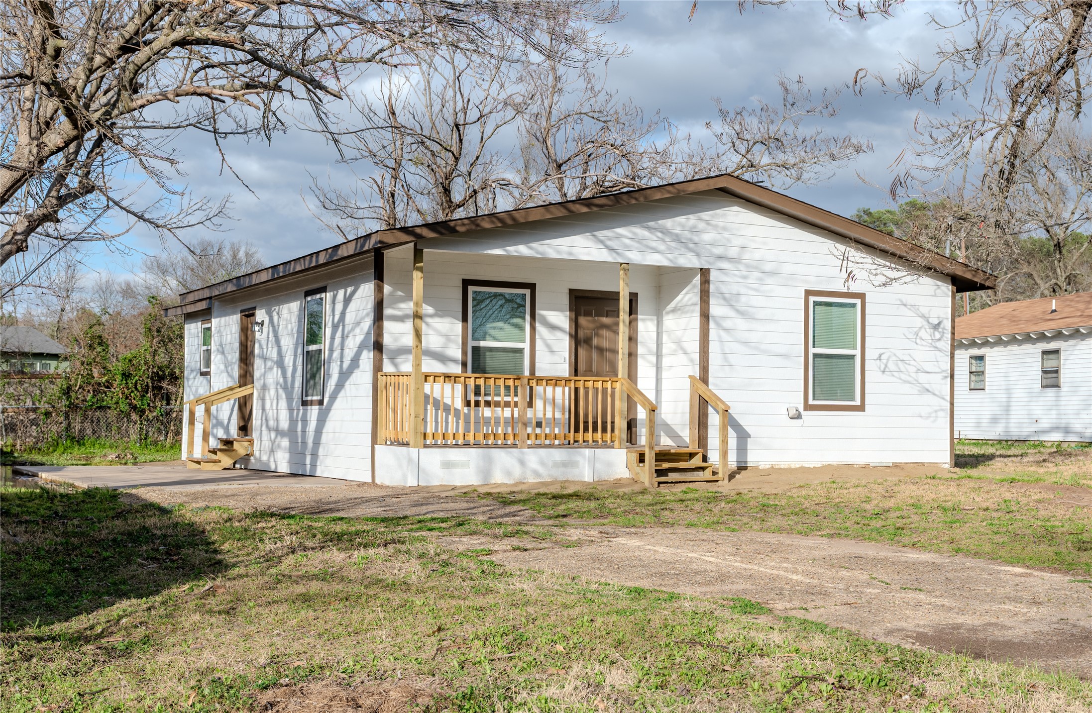 729 Planters Street Emory, TX 75440 - Photo 2 of 22 a front view of a house with a yard