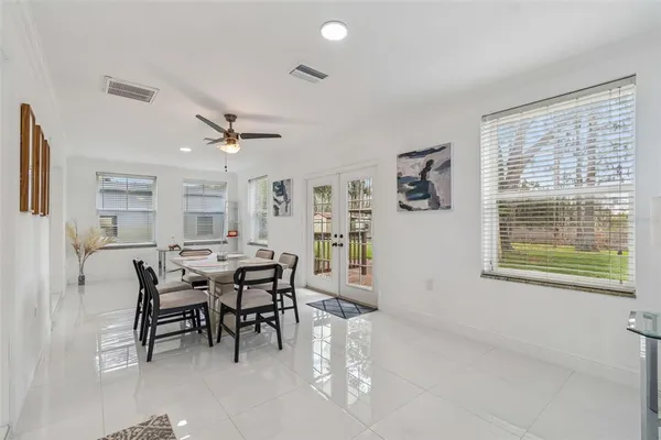 a view of a dining room with furniture and a window