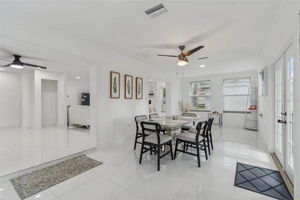 a dining room with furniture and window