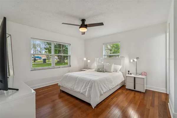 a bedroom with a bed and window