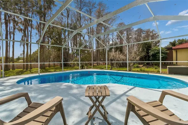 a view of a chairs and table on the deck