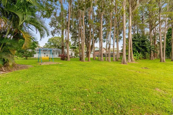an aerial view of residential building and lake