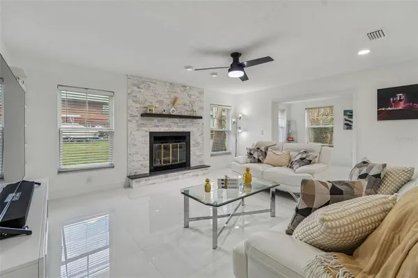 a living room with furniture and a fireplace