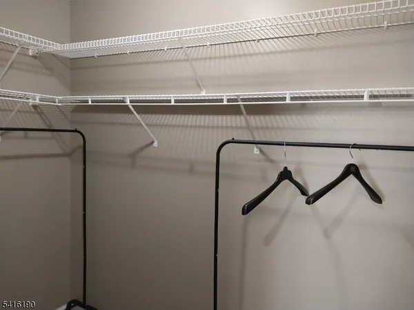 a view of a room with racks on the wall
