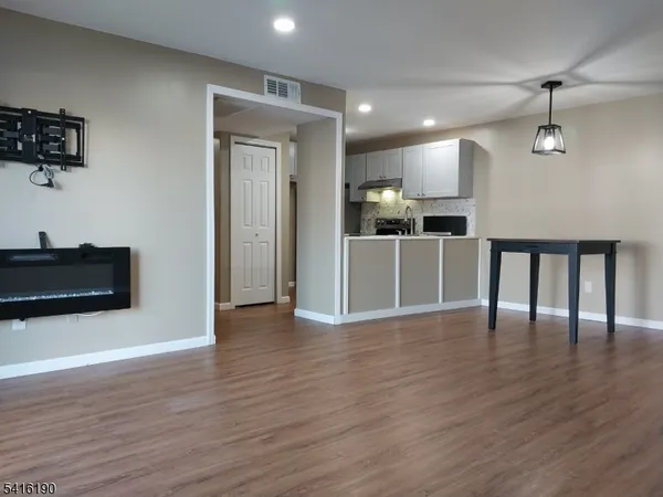 a view of a kitchen with a sink and a microwave